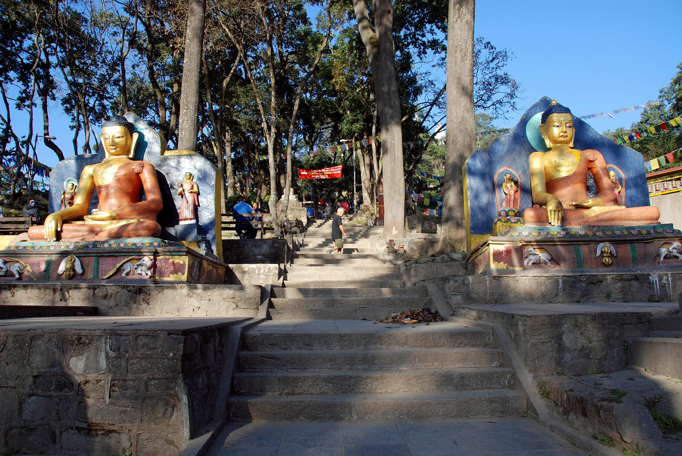 Kathmandu Swayambhunath 07 Two Buddha Statues At Entrance Gate 